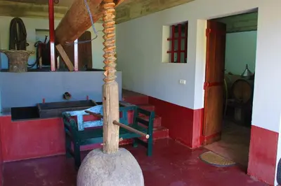 a room with a table and chairs in a house at Villa Ricardo in Porto da Cruz