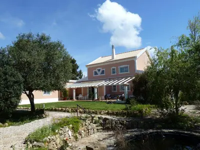 a house with a pond in front of it at Highview Villa in Lagos