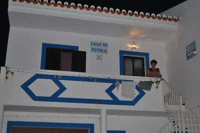 a woman standing on a shelf in a room at Casa Da Estela in Carrapateira