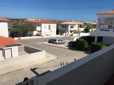 a view from a balcony of a street with houses at Casa Da Estela in Carrapateira