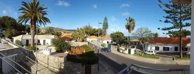 a view of a town with houses and a street at Sotavento Guest House in Porto Santo