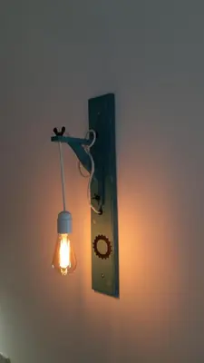 a light that is attached to a wall at Cercas Velhas in Sagres