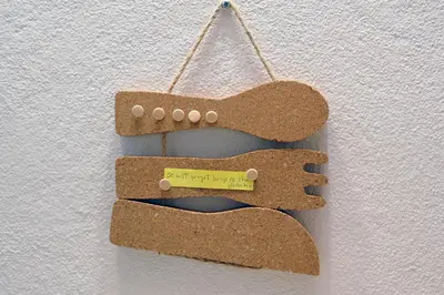 a cork ornament hanging on a white wall at 16 Porto Santo Apartments in Porto Santo
