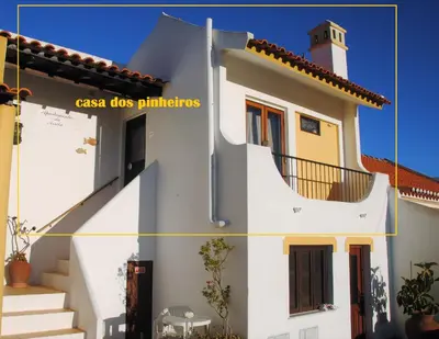 a picture of a white house with the names of its windows at Casa dos Pinheiros in Praia da Arrifana