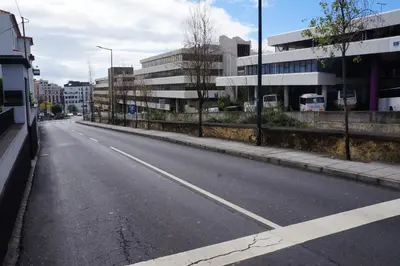 an empty street in a city with buildings at Casa Violeta in Funchal