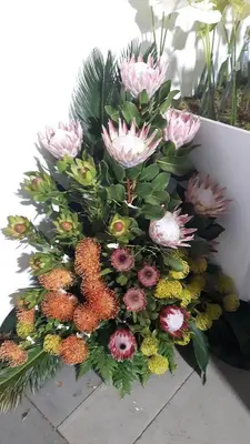 a bouquet of flowers sitting on a table at Casa Violeta in Funchal