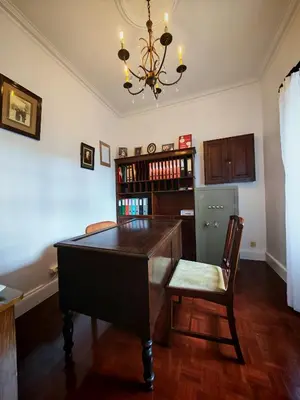 a dining room with a ping pong table and a chandelier at A Casa Do Caseiro in Funchal