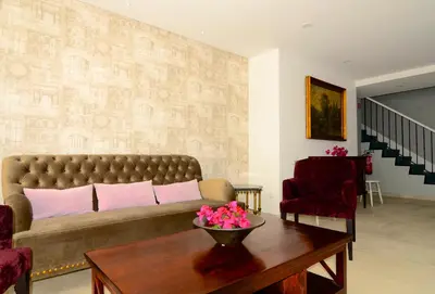 a living room with a couch and a table at Vila Toca in Funchal