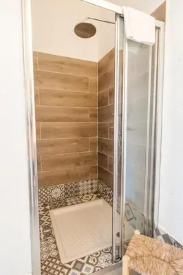 a shower with a glass door in a bathroom at Utopia in Aljezur