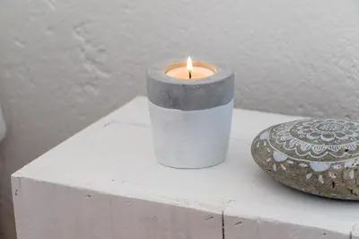 a candle sitting on top of a white table at Utopia in Aljezur