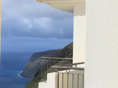 a balcony with a view of the ocean at The best sea view in Madeira - Casa Farol in Fajã da Ovelha