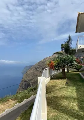 a view of the ocean from a house at The best sea view in Madeira - Casa Farol in Fajã da Ovelha