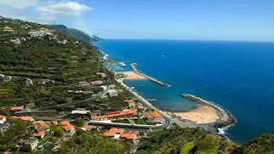 an aerial view of a beach and the ocean at The best sea view in Madeira - Casa Farol in Fajã da Ovelha