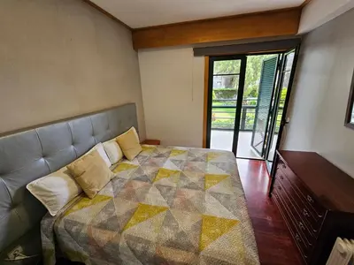 a bedroom with a bed with a quilt on it at Ilheus 1 in Funchal