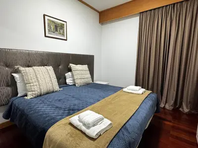 a bedroom with a bed with two towels on it at Ilheus 1 in Funchal