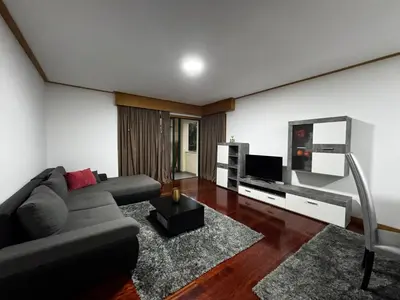 a living room with a couch and a flat screen tv at Ilheus 1 in Funchal