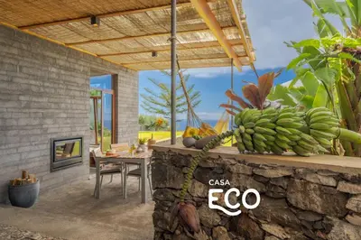 a room with a table with a bunch of bananas at Casas Da Vereda in Estreito da Calheta