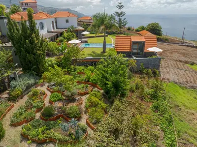 an aerial view of a garden in front of a house at Casas Da Vereda in Estreito da Calheta