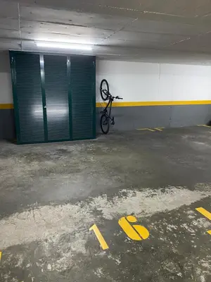 a bike is parked in a parking garage at Casa do Cavacas in Funchal