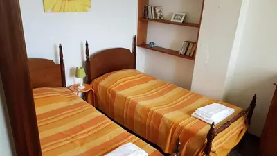 two beds in a small room with at Casa da Camacha in Porto Santo