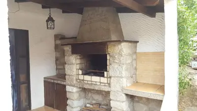 an outdoor brick oven in the side of a house at Casa da Camacha in Porto Santo