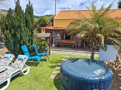 a backyard with a view of the ocean at Casa d'Alegria Madeira Island in Ribeira Brava