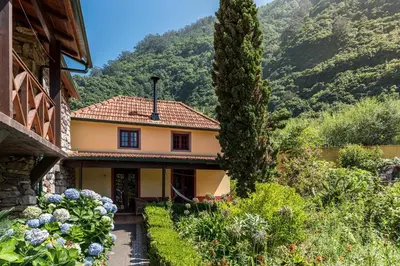a house with a view of a mountain at Pestana Quinta do Arco Nature & Rose Garden Hotel in Arco de São Jorge