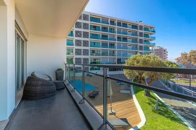 a balcony with a view of a building at Monumental Residence apartment with pool by HR Madeira in Funchal