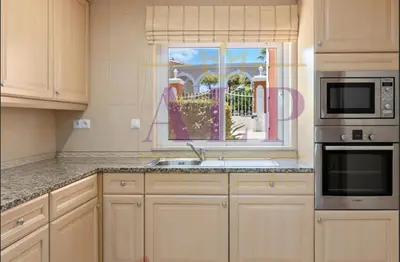a kitchen with a sink and a window at 4 bed 4 bathroom villa Quinta da Boavista in Lagos