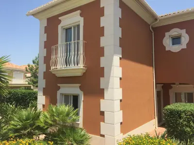a building with a balcony on the side of it at 4 bed 4 bathroom villa Quinta da Boavista in Lagos