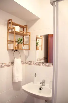 a bathroom with a sink and a mirror at Lilas' Private Accommodation in Vila do Bispo