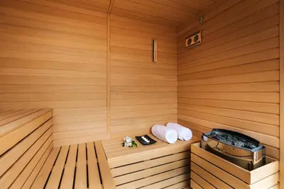 a sauna with two towels and a tray in it at Pestana CR7 Funchal in Funchal