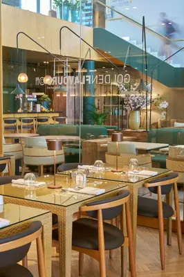 a restaurant with tables and chairs in a room at Golden Residence Hotel in Funchal
