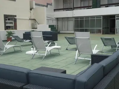 a group of chairs sitting on a patio at Residencial Greco in Funchal