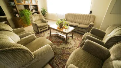 a living room with couches and a coffee table at Hotel Sirius in Funchal