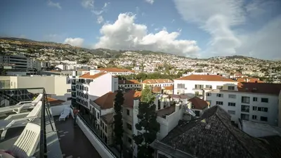 a view of a city with white buildings at Hotel Sirius in Funchal