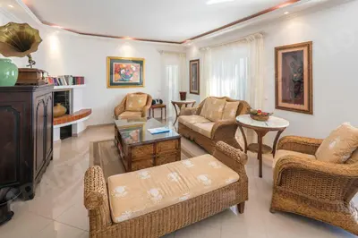 a living room with a couch and chairs at Maio Apartment in Luz