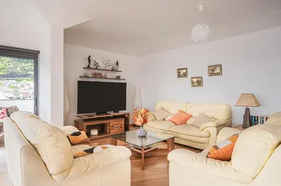 a living room with two couches and a tv at Beachfront Penthouse with Panoramic Ocean-View Terrace VIP Baia in Machico