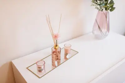 a table with three glass vases on it at Vip VI - Sea view apartment in Caniço