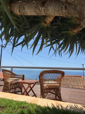 a swimming pool with a view of the ocean at Casa do Poço Funchal in Funchal