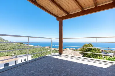 a view of the ocean from the balcony of a house at Apartment Annie 2 in Arco da Calheta