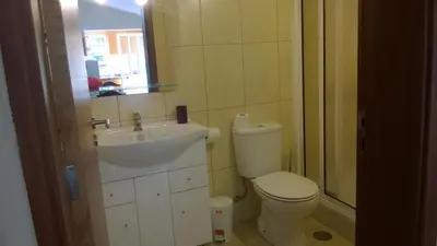 a small bathroom with a toilet and a sink at Apartamento Teixeira 2 in Arco da Calheta