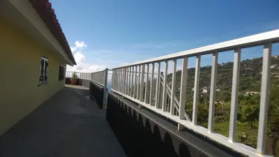 a balcony with a view of a mountain at Apartamento Teixeira 2 in Arco da Calheta