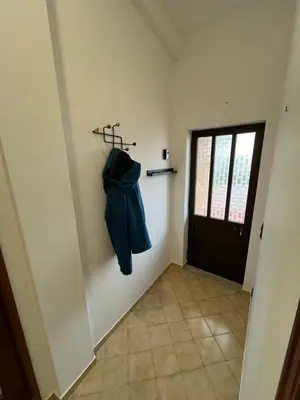 a hallway with a coat hanging on a wall at Villa Boa Vista Sul - Terra da Eira - Raposeira in Vila do Bispo