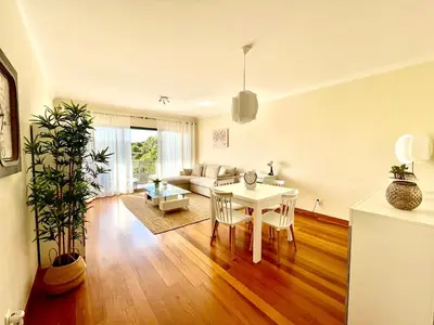 a living room with a table and a couch at Plaza Charming Flat in Santa Cruz