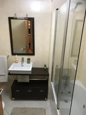 a bathroom with a sink and a shower at Plaza Charming Flat in Santa Cruz