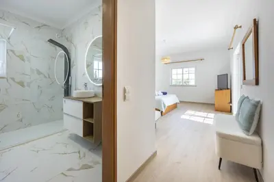 a kitchen with a table and chairs in a room at Sunflower Villa by Seewest in Lagos
