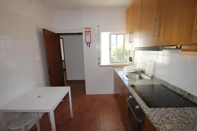 a kitchen with a sink and a counter top at T3 Casa dos Arcos by Seewest in Salema