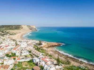 an aerial view of a beach with houses and the ocean at T2 Casa dos Arcos by Seewest in Salema