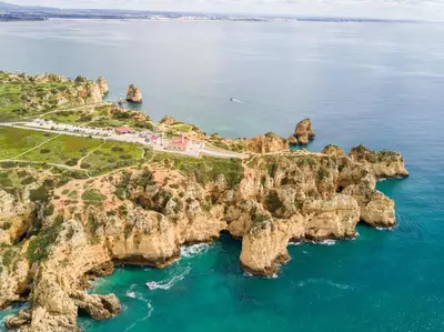 an aerial view of a rocky island in the ocean at T2 Casa dos Arcos by Seewest in Salema